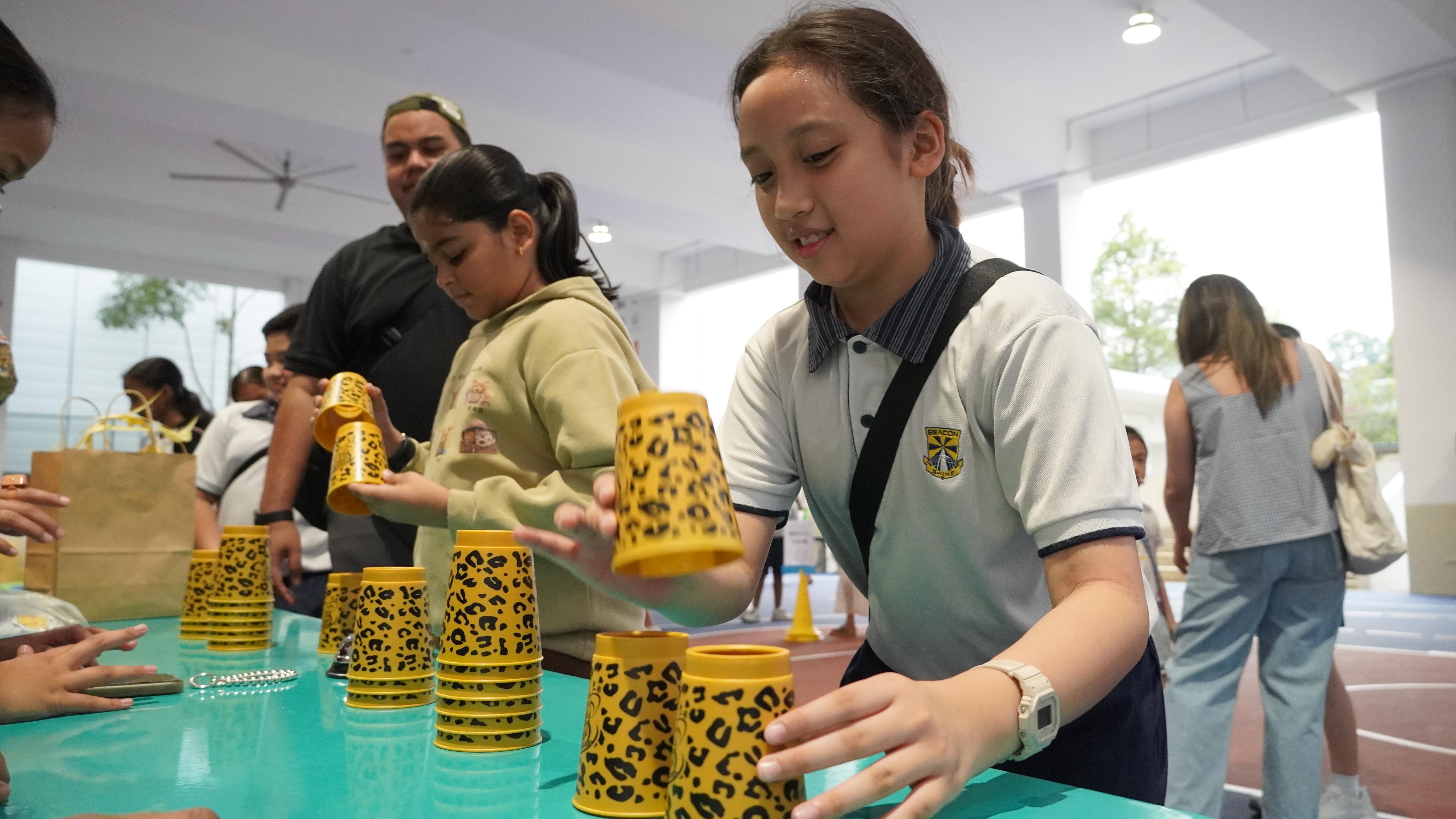 Ready, set, stack! Quick hands and sharp focus come together in this fast-paced cup-stacking challenge.
